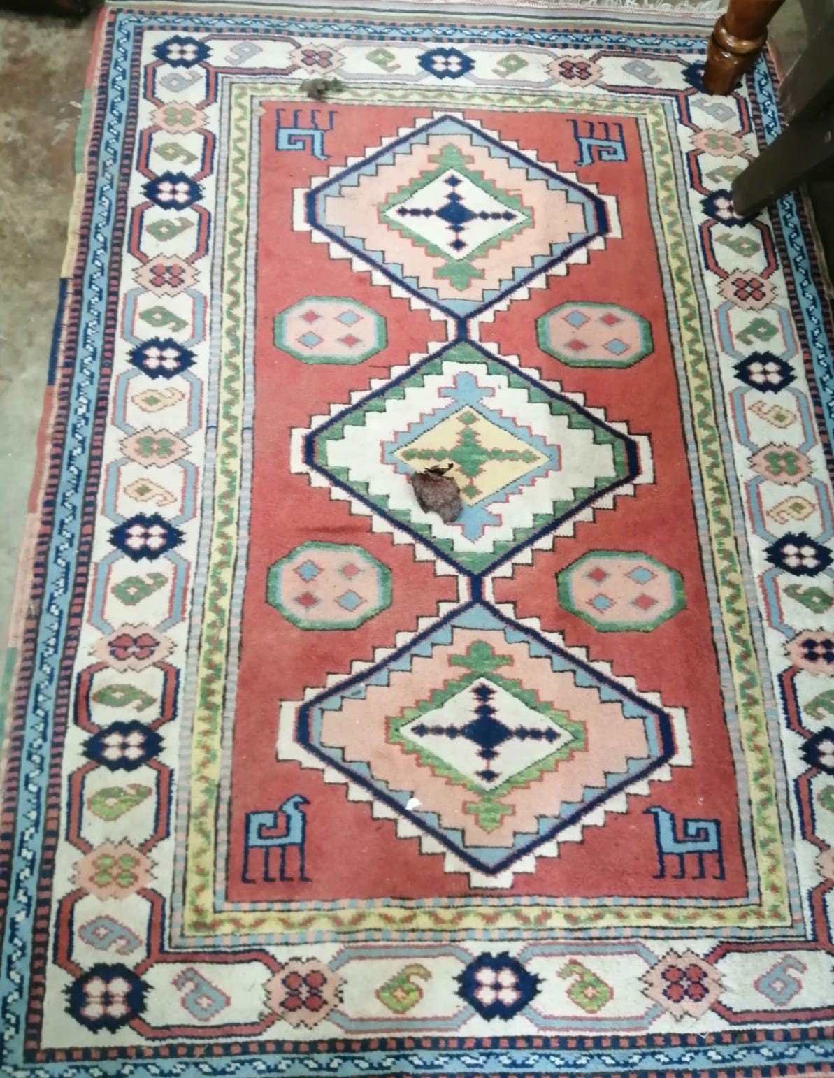 A Caucasian style rug, 174 x 117cm *Please note the sale commences at 9am.